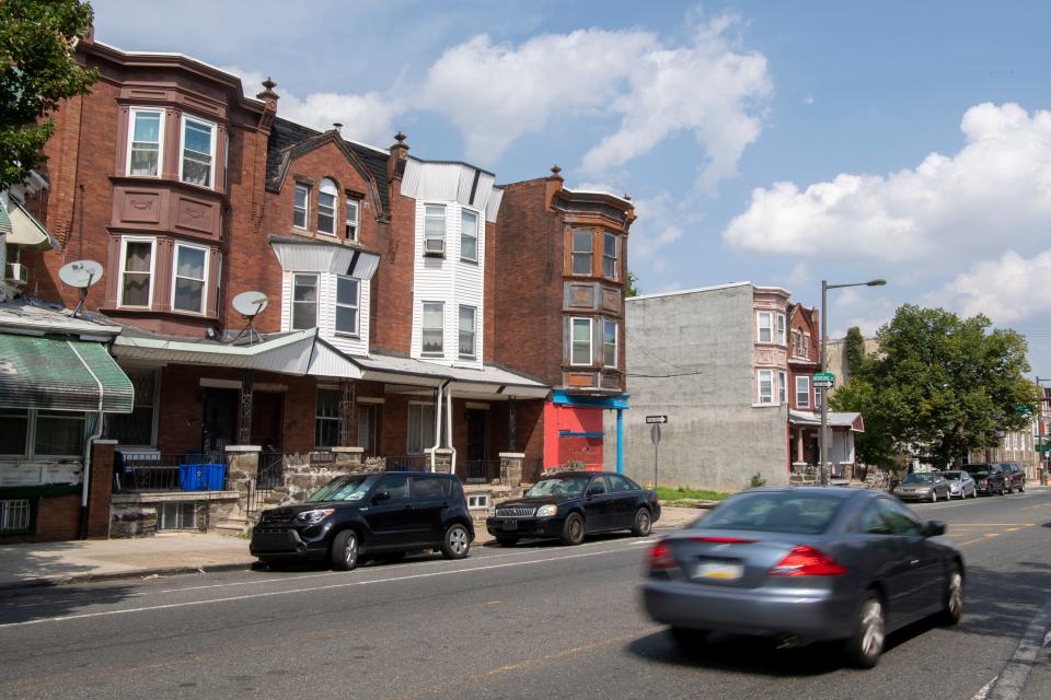 Cars pass by the home of Patricia Blair  in North Philadelphia.