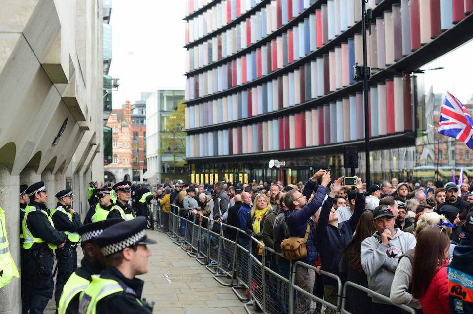 Police keep an eye on crowds of supporters of Tommy Robinson (Picture: PA)