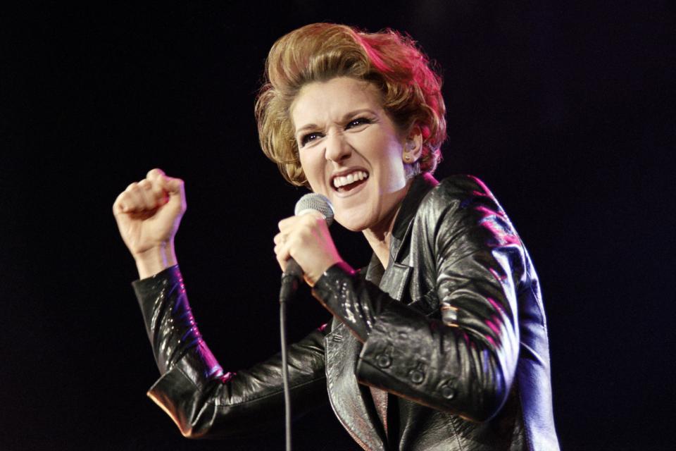 Canadian singer Celine Dion performs December 4, 1995 on the stage of Bercy concert hall in Paris.   AFP PHOTO BERTRAND GUAY        (Photo credit should read BERTRAND GUAY/AFP/Getty Images)