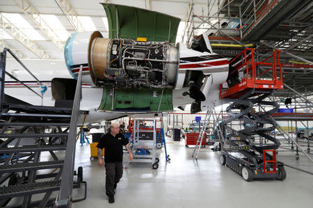 A technician works on a Bombardier Global aircraft at the company's service centre at Biggin Hill, Britain March 5, 2018. REUTERS/Peter Nicholls