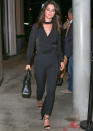 <p>Gomez was spotted hitting the town in a chic black number made up of a wrap top with choker details, matching trousers, and strappy heeled sandals. A black leather bag and red manicure completed her Los Angeles-ready outfit.</p>