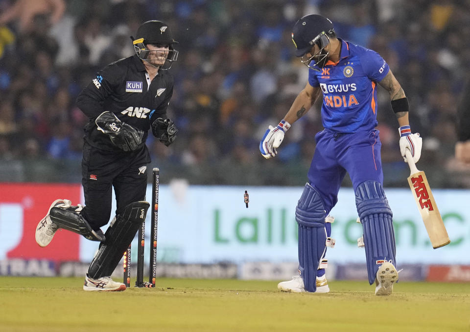 New Zealand's captain and wicketkeeper Tom Latham, left, celebrates the dismissal of India's Virat Kohli, right, during the second one-day international cricket match between India and New Zealand in Raipur, India, Saturday, Jan. 21, 2023. (AP Photo/Aijaz Rahi)