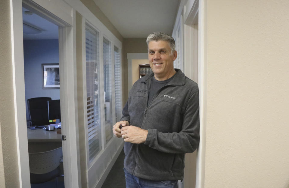 In this Friday, Oct. 26, 2018, photo, San Juan County commissioner Phil Lyman looks on following an interview at his office in Blanding, Utah. As Native American tribes around the country fight for increased access to the ballot box, Navajo voters in one Utah county could tip the balance of power in the first general election since a federal judge ordered overturned their voting districts as illegally drawn to minimize native voices. (AP Photo/Rick Bowmer)