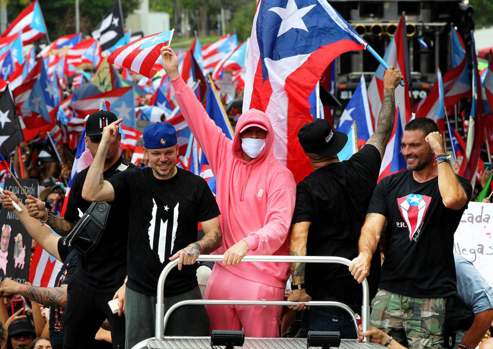 Artists Residente and Bad Bunny join a march a day after Puerto Rico's then-governor, Ricardo Rossell&oacute;, announced he would step down after 13 days of protests all across Puerto Rico.&nbsp; (Photo: Pedro Portal/Miami Herald/Tribune News Service via Getty Images)