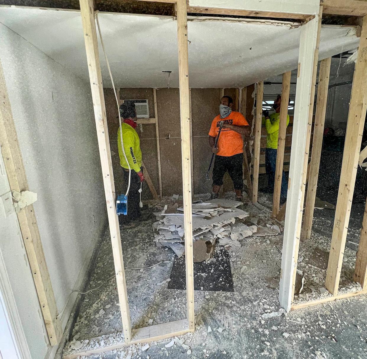 A small room is demolished inside the Ferriter family' garage in Jupiter's Egret Landing neighborhood on March 5, 2022. Timothy and Tracy Ferriter were arrested Feb. 8 and charged which child abuse and false imprisonment after investigators learned they locked their 14-year-old teen in the room for up to 18 hours at a time when they were misbehaving.