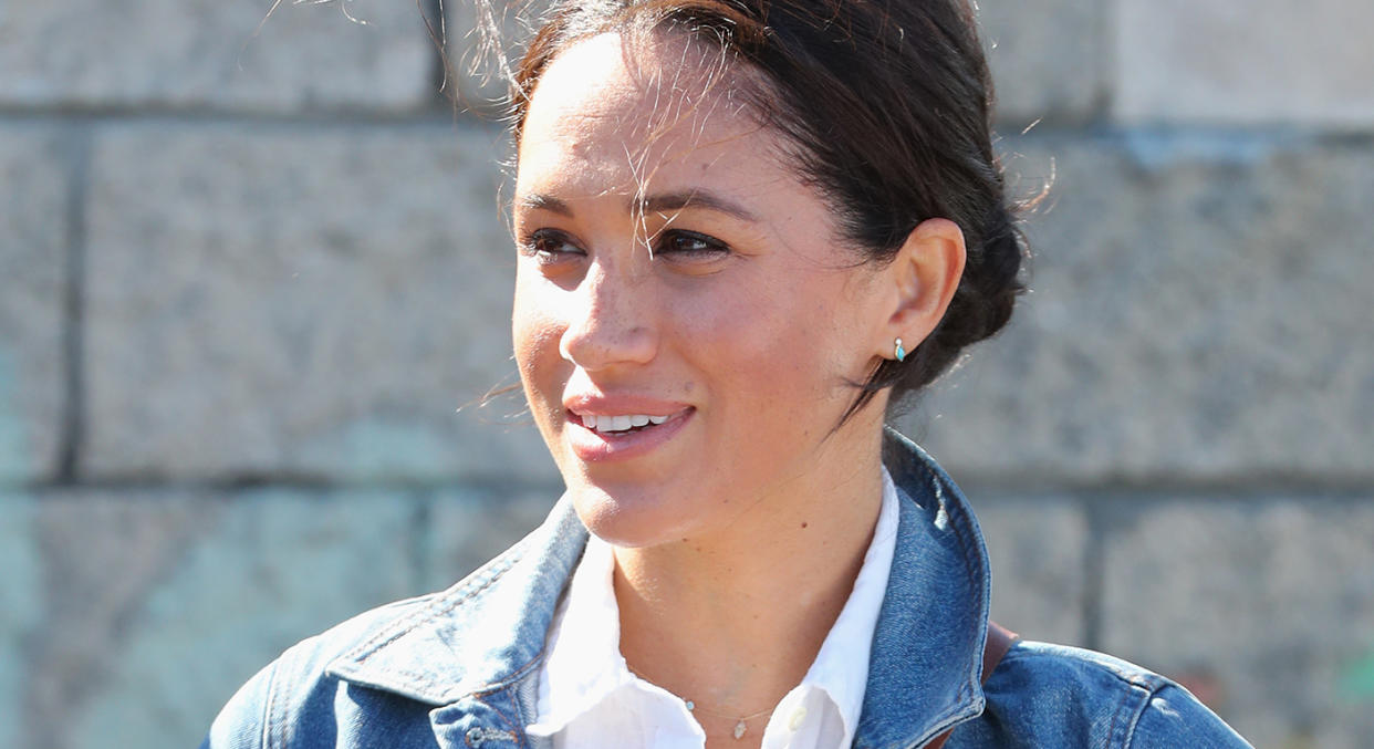 Meghan, pictured here on September 24, 2019 in Cape Town, and Harry marked the anniversary of Princess Diana's death by planting flowers with school children. (Getty Images)