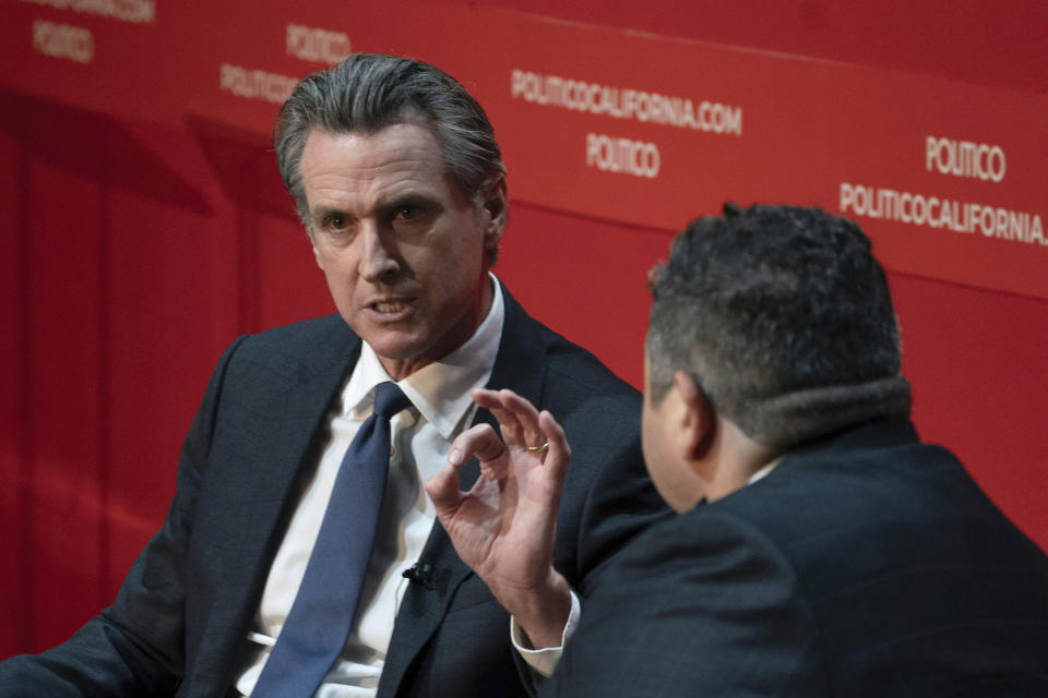 California Gov. Gavin Newsom, left, speaks to Politico California Bureau Chief Chris Cadelago during an interview in Sacramento, Calif., Tuesday, Sept. 12, 2023. Newsom said the state will intervene in an ongoing federal court case that has barred San Francisco from cleaning up homeless encampments. (AP Photo/Rich Pedroncelli)