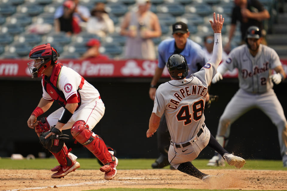 Detroit Tigers' Kerry Carpenter (48) scores off of a single by Willi Castro during the seventh inning of a baseball game against the Los Angeles Angels in Anaheim, Calif., Wednesday, Sept. 7, 2022. (AP Photo/Ashley Landis)