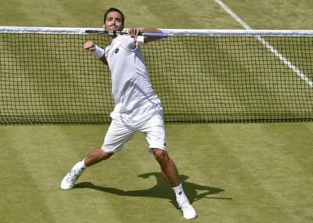 Viktor Troicki of Serbia celebrates after winning his match against Dustin Brown of Germany at the Wimbledon Tennis Championships in London, July 4, 2015. REUTERS/Toby Melville