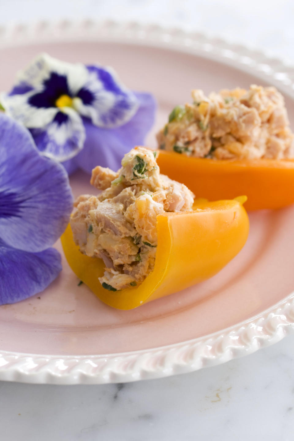 In this image taken on April 22, 2013, stuffed baby bell peppers are shown served on a plate in Concord, N.H. (AP Photo/Matthew Mead)