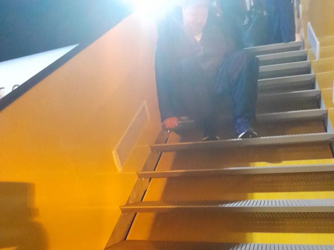 Adrian Keogh crawls down the steps of his Ryanair flight to Sweden after special assistance fails to arrive.