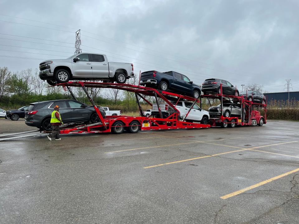 A shipment of vehicles arrived May 3, 2021, at Matick Chevrolet in Redford. A shortage of semiconductor chips used in car parts has created inventory constraints. Nearly half the vehicles coming off this hauler are already sold from customers’ pre-orders.