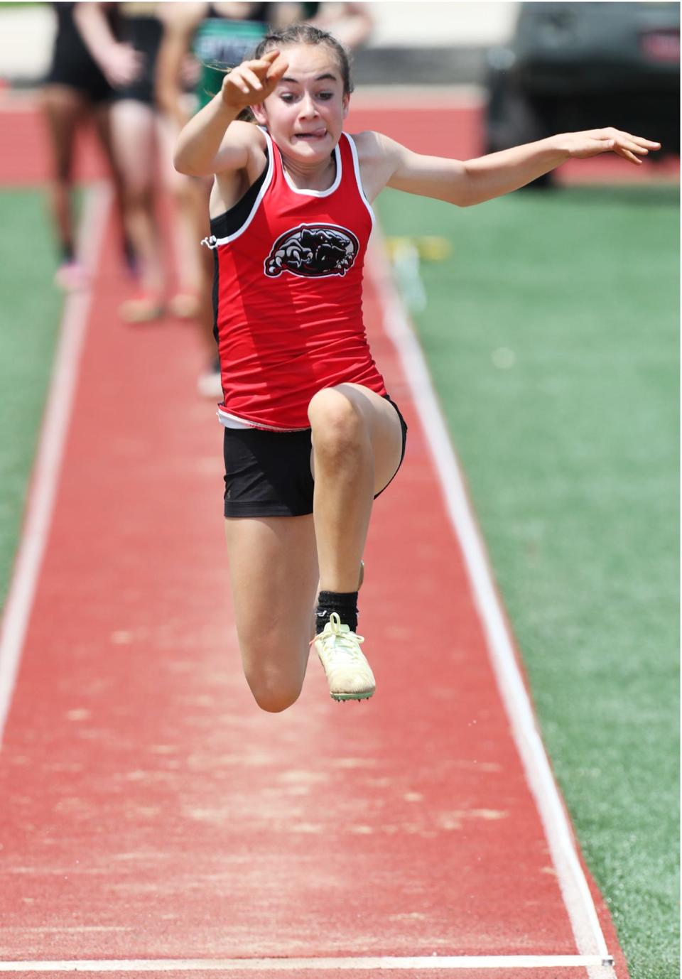 Manchester's Ramsey Dennison competes in the finals of the Girls Long Jump at the Division II District Track and Field finals at Sebo Stadium in Salem on Saturday. Dennison placed 4th with a distance of 15' 5.5".