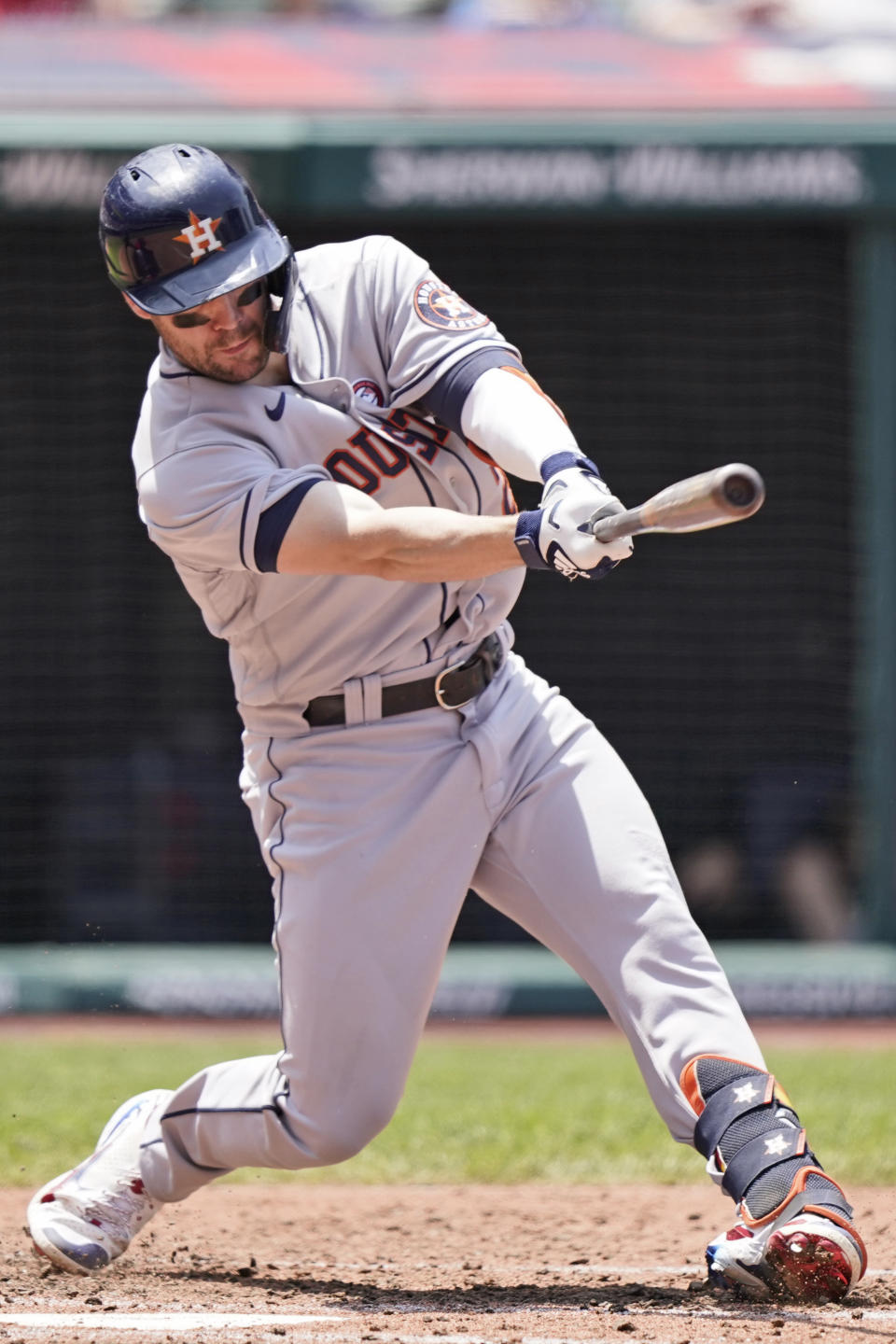 Houston Astros' Chas McCormick hits an RBI-single in the fourth inning of a baseball game against the Cleveland Indians, Sunday, July 4, 2021, in Cleveland. (AP Photo/Tony Dejak)