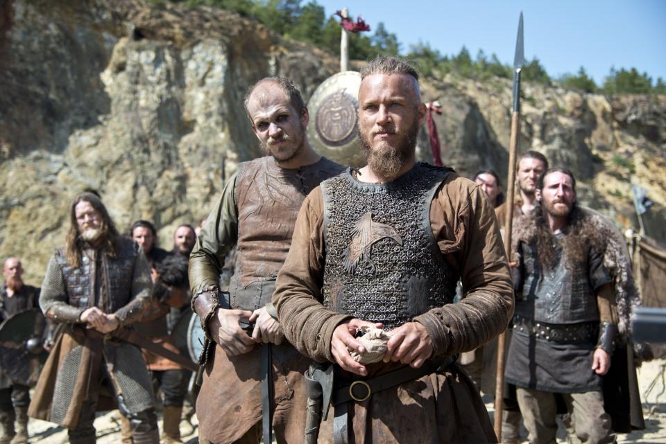 In this photo dated July, 8 2013 Ragnar, front, played by actor Travis Fimmel, a leading character from television show Vikings, History’s brooding and brutal drama about the 8th-century Nordic warrior Ragnar Lothbrok. After a six-month shoot in Ireland, season two debuts Thursday night sporting a bigger scale, more confident pace and stronger entertainment than last year’s uneven, at-times plodding inaugural run.(AP Photo/Bernard Walsh/History)