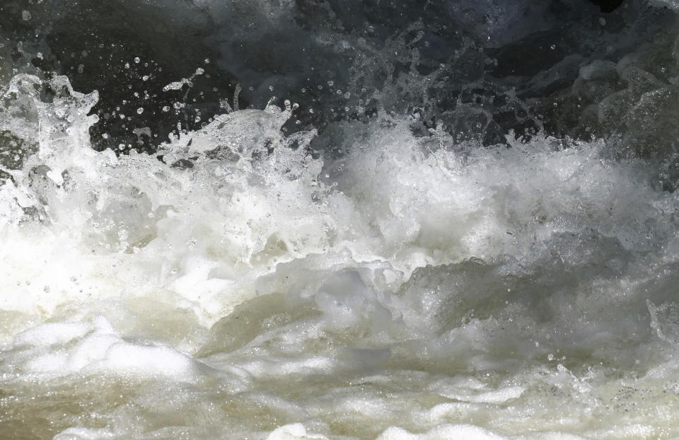 This Tuesday, June 11, 2019, photo shows the raging waters in the Big Cottonwood Creek, near Salt Lake City. The summer's melting snowpack is creating rivers that are running high, fast and icy cold. The state's snowpack this winter was about 150 percent higher than the historical average and double the previous year, which was the driest on record dating back to 1874, said Brian McInerney, hydrologist for the National Weather Service in Salt Lake City. Large parts of the Salt Lake City metro area sits near the foothills of the towering Wasatch Range. (AP Photo/Rick Bowmer)