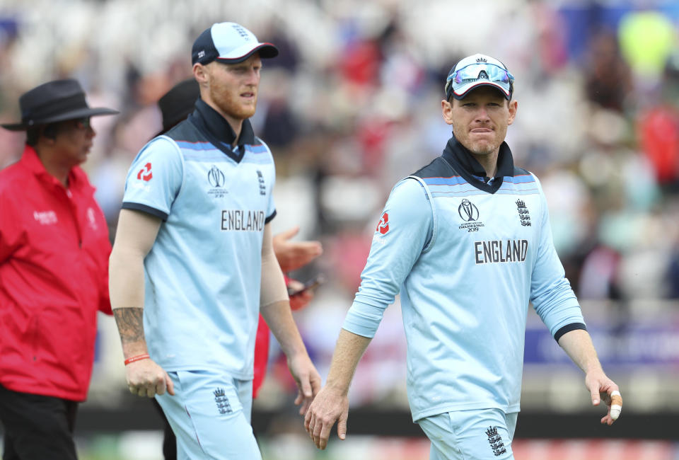 England's captain Eoin Morgan, right, and teammate Ben Stokes leave the filed at the end of Pakistan innings during the Cricket World Cup match between England and Pakistan at Trent Bridge in Nottingham, Monday, June 3, 2019. (AP Photo/Rui Vieira)
