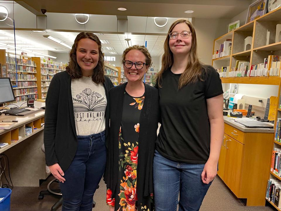 Desk assistant Maggie Greenisen, Branch Manager Anna Wooliver-Phillips and desk assistant Madison Brown greet LEGO Club participants with a smile at Karns Branch Library on June 10.