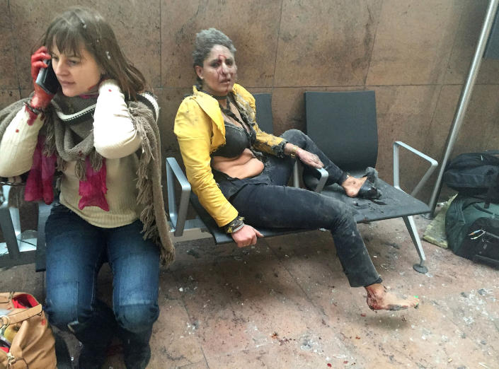<p>MAR. 22 – 2016 — Flight attendant Nidhi Chaphekar (R) reacts in the moments following a suicide bombing at Brussels Zaventem airport in Brussels, Belgium. Georgian journalist Ketevan Kardava, special correspondent for the Georgian Public Broadcaster, was travelling to Geneva when the attack took place, she was knocked to the floor and began to take photographs in the moments that followed. At least 31 people were killed and more than 260 injured in a twin suicide blast at Zaventem Airport and a further bomb attack at Maelbeek Metro Station. (Ketevan Kardava/Getty Images) </p>