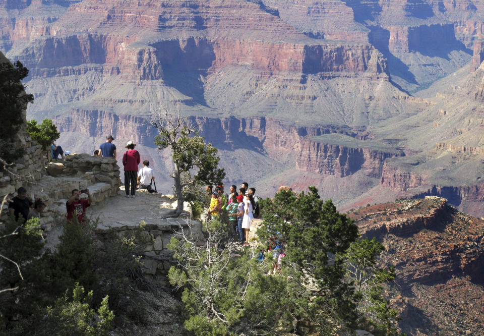 Visitors at an outlook on the South Rim of Grand Canyon National Park in Arizona. (Photo: Felicia Fonseca/AP)