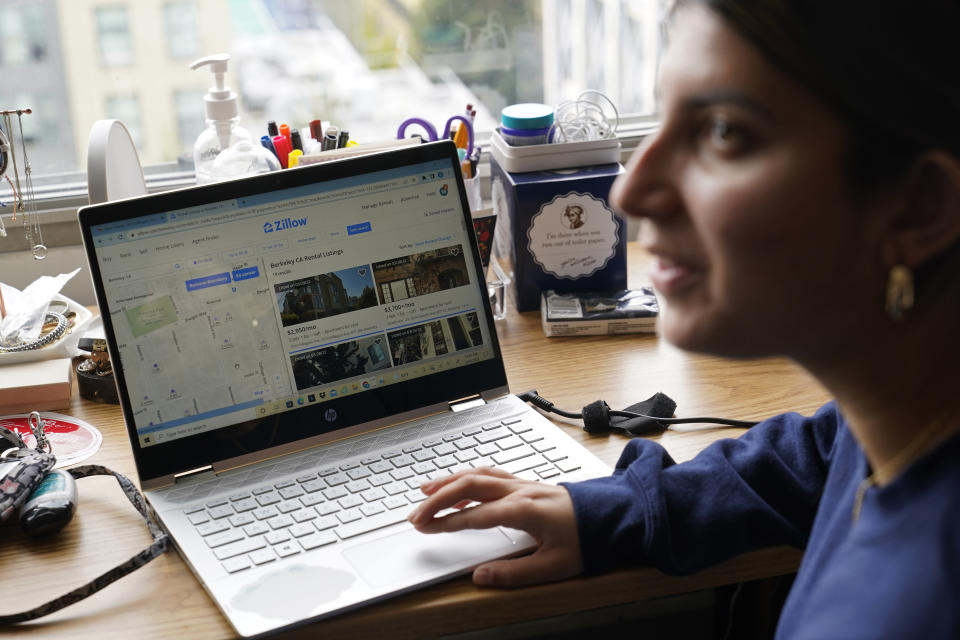 University of California, Berkeley freshman Sanaa Sodhi talks with a friend in her on-campus dorm room while searching online for apartments in Berkeley, Calif., Tuesday, March 29, 2022. Millions of college students in the U.S. are trying to find an affordable place to live as rents surge nationally, affecting seniors, young families and students alike. Sodhi is looking for an apartment to rent with three friends next fall, away from the dorms but still close to classes and activities on campus. They've budgeted at least $5,200 for a two-bedroom. (AP Photo/Eric Risberg)