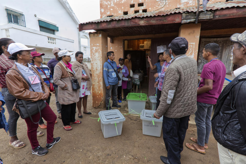 People gather at a polling station in the presidential election in Antananarivo, Madagascar Thursday, Nov. 16, 2023. Madagascar's President Andry Rajoelina is pushing ahead with a presidential election Thursday, that could give him a third term, even as opposition protests roil the country and the majority of candidates have announced a boycott. (AP Photo/Alexander Joe)