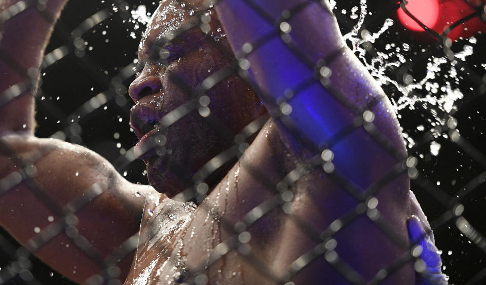 Brazil's Anderson Silva pours water on his face after his middleweight bout against Nigeria's Israel Adesanya at the UFC 234 event in Melbourne, Australia, Sunday, Feb. 10, 2019. (AP Photo/Andy Brownbill)