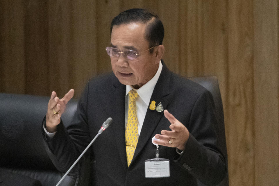 Thailand's Prime Minister Prayuth Chan-ocha answers a question at parliament in Bangkok, Thailand, Wednesday, Sept. 18, 2019. Prayuth has come under fire in a parliamentary debate because he omitted a key phrase in taking his oath of office in July, but dodged opposition demands to explain why he had left it out. (AP Photo/Sakchai Lalit)