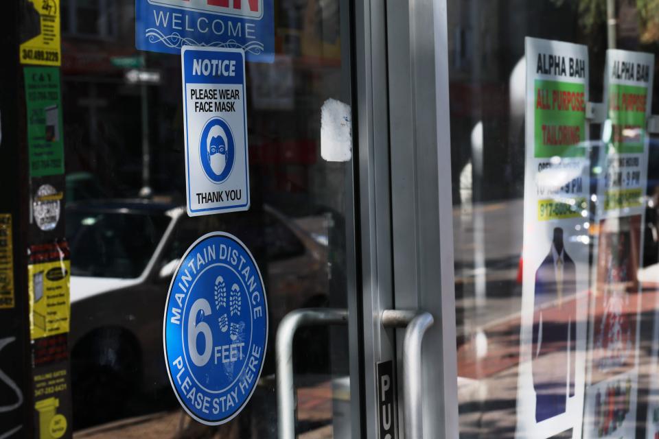 A mask-required sign is seen on Sept. 1, 2023, on the door of a store in New York City. Arizona law forbids government from enacting similar mandates.