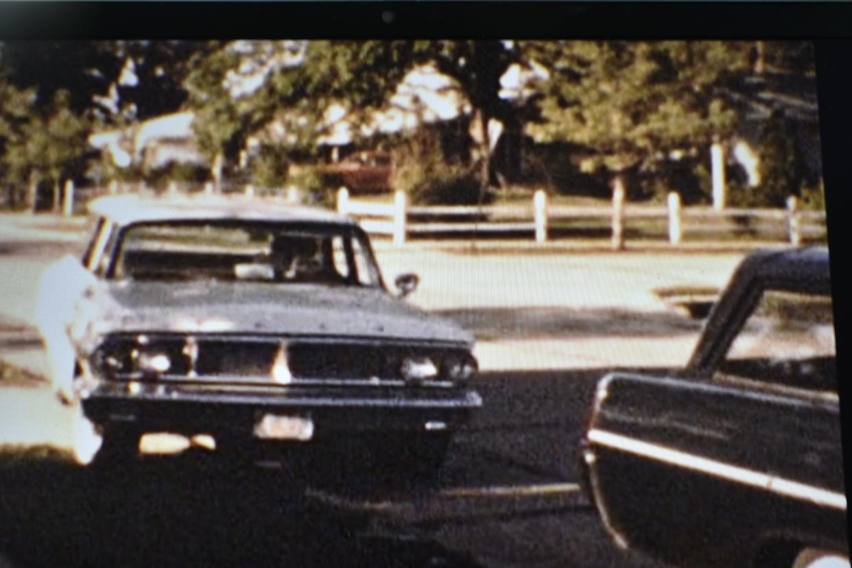 My aunt, Marilyn Huntsman, behind the wheel of a Ford station wagon pulling up to my grandparents' house on Fredonia Road in Indianapolis, in 1965 or '66.