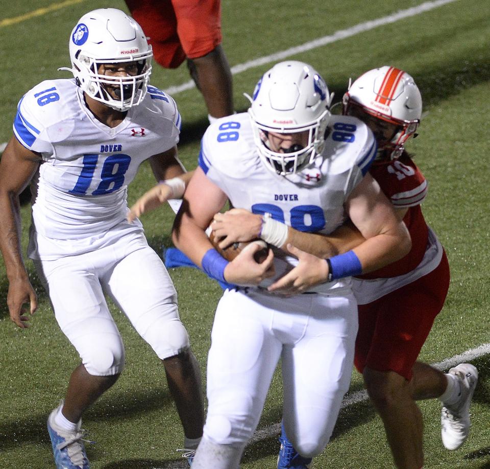 Ryan Perkins (88) strips the ball away from Smyrna quarterback Jacob Tiberi on Friday night.