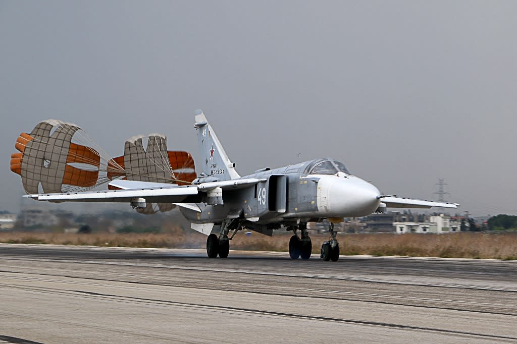 A Russian Sukhoi Su-24 bomber lands at the Russian Hmeymim military base in Latakia province, Syria (Picture: AFP)