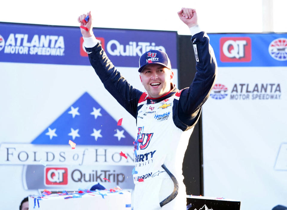 March 20, 2022;  Hampton, Georgia, USA;  NASCAR Cup Series driver William Byron (24) celebrates in victory lane by winning the Folds of Honor QuikTrip 500 at Atlanta Motor Speedway.  Required credit: John David Mercer-USA TODAY Sports