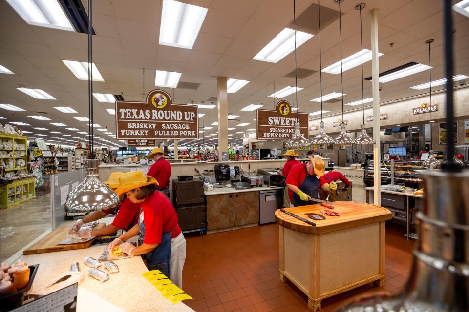 Buc-ee's employees at the Texas Round Up station, which serves brisket, sausage, turkey and pulled pork.