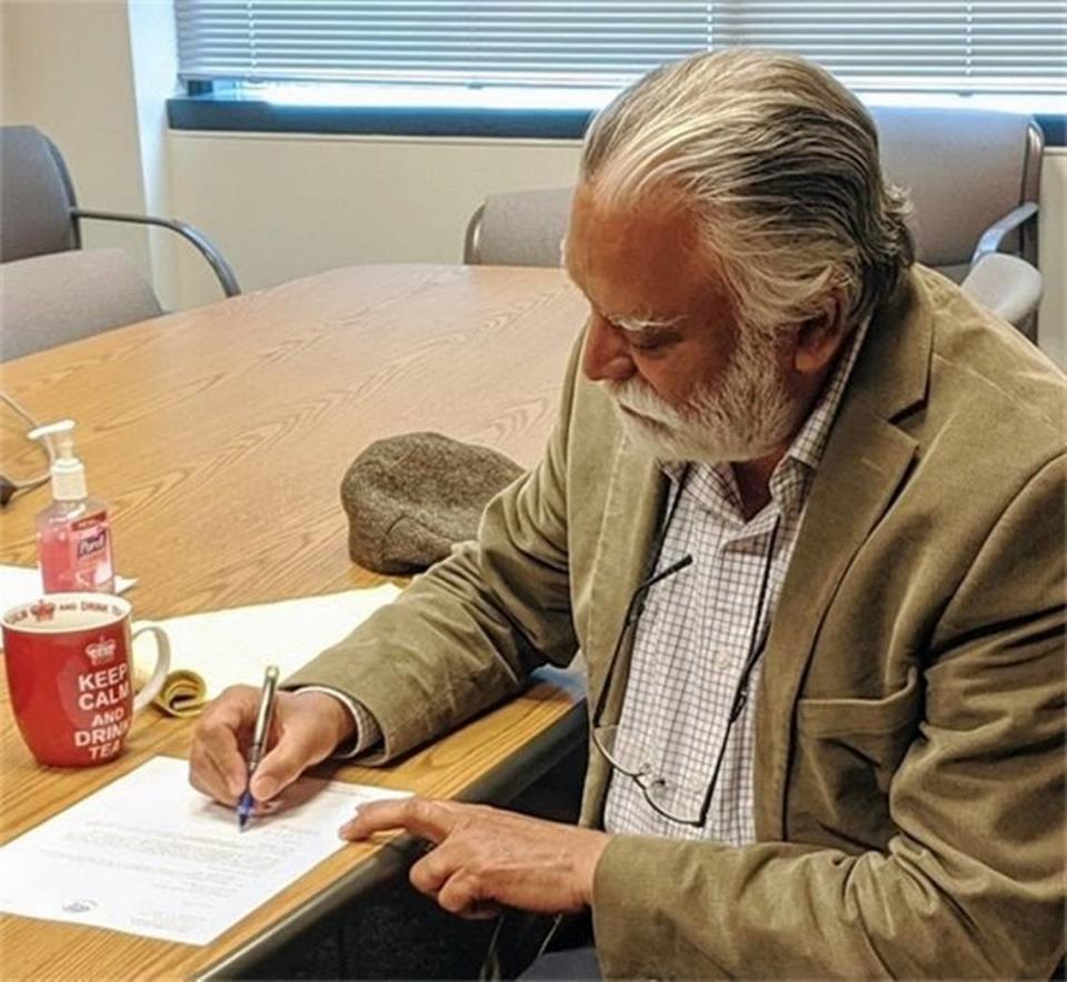 Whatcom County Executive Satpal Sidhu signs the county’s application to move to Phase 2 of “Safe Start Washington” on Tuesday, June 2, 2020, in Bellingham. A generally positive draft report about Whatcom County’s response to the COVID pandemic noted that many leaders had been recently elected when the pandemic began.