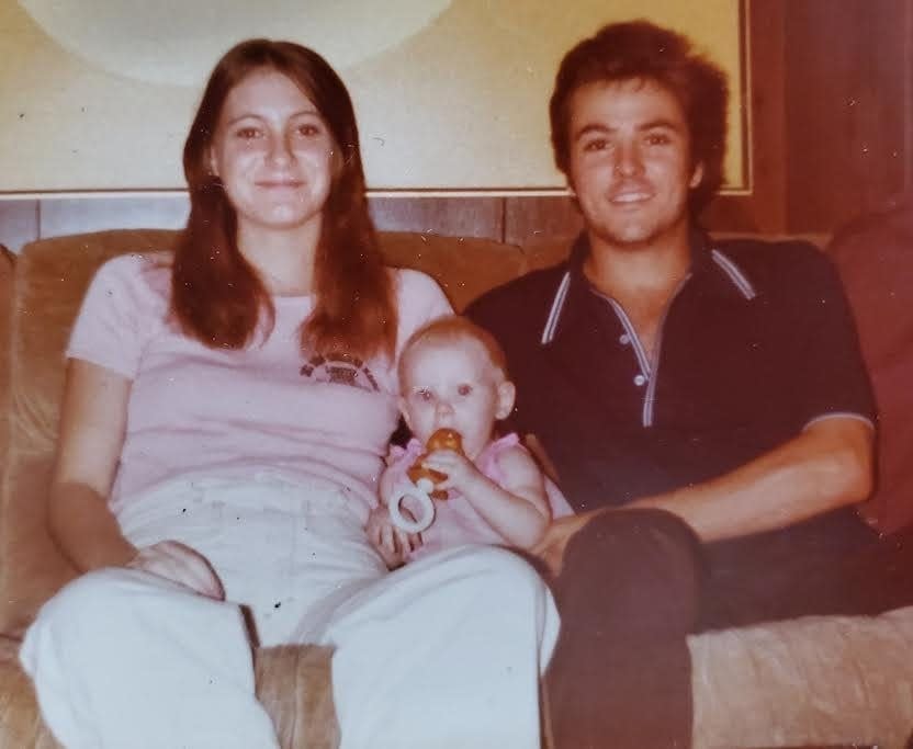A family photo of Tina Gail Linn Clouse, infant Holly Clouse, and Harold Dean Clouse Jr.