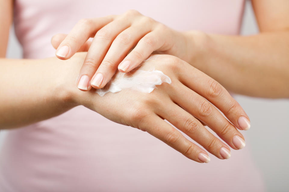 beautiful woman hands with cream