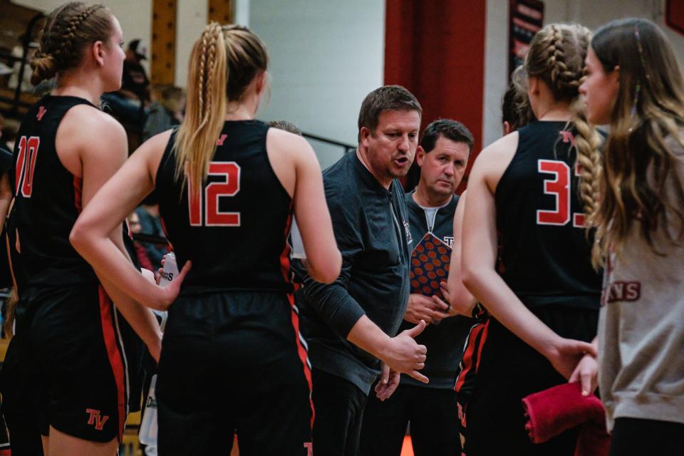 Tusky Valley head coach Matt Ward talks to his team during a time out in the game against New Philadelphia, Wednesday, Feb. 8.