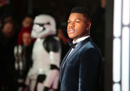 Actor John Boyega poses for photographers as he arrives for the European Premiere of 'Star Wars: The Last Jedi', at the Royal Albert Hall in central London, Britain December 12, 2017. REUTERS/Hannah McKay
