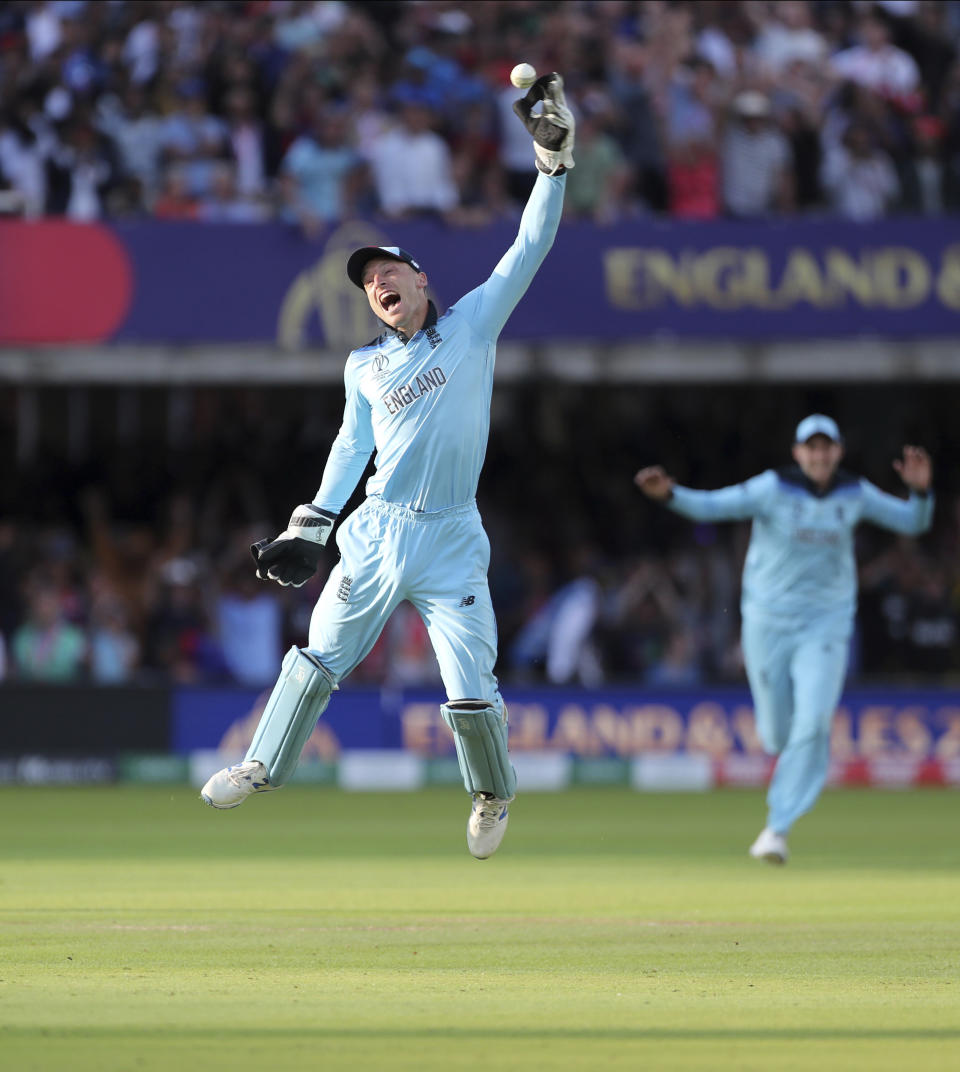 England's Jos Buttler celebrates after running out New Zealand's Martin Guptill during the Super Over in the Cricket World Cup final match between England and New Zealand at Lord's cricket ground in London, England, Sunday, July 14, 2019. (AP Photo/Aijaz Rahi)