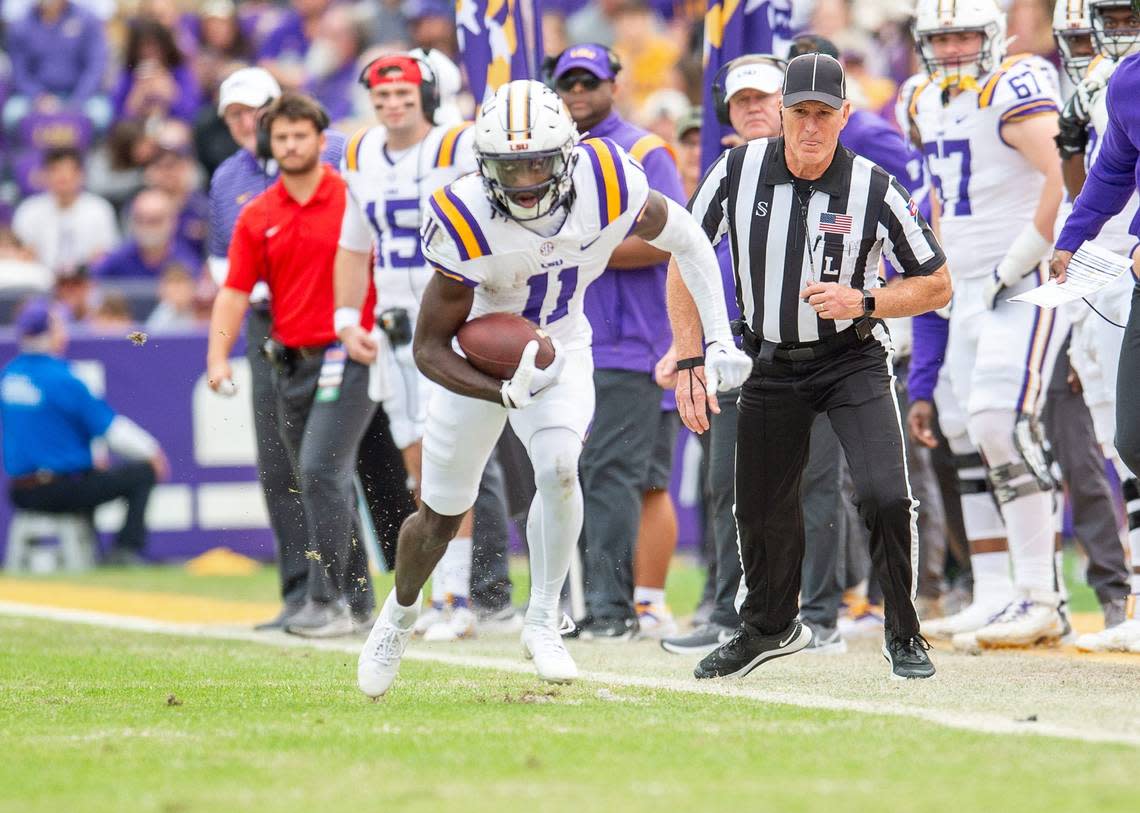 Brian Thomas Jr 11 runs the ball as the LSU Tigers take on Texas A&M in Tiger Stadium in Baton Rouge, Louisiana, November 25, 2023.