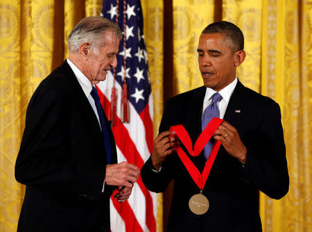 FILE PHOTO - U.S. President Barack Obama awards the 2012 National Humanities Medal to sports writer Frank Deford during a ceremony in the East Room of the White House in Washington, DC, U.S. on July 10, 2013. REUTERS/Kevin Lamarque/File Photo