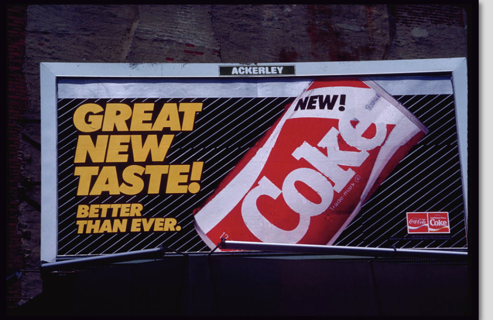 Billboard of a New Coke advertisement with the tagline "Great New Taste! Better Than Ever!"