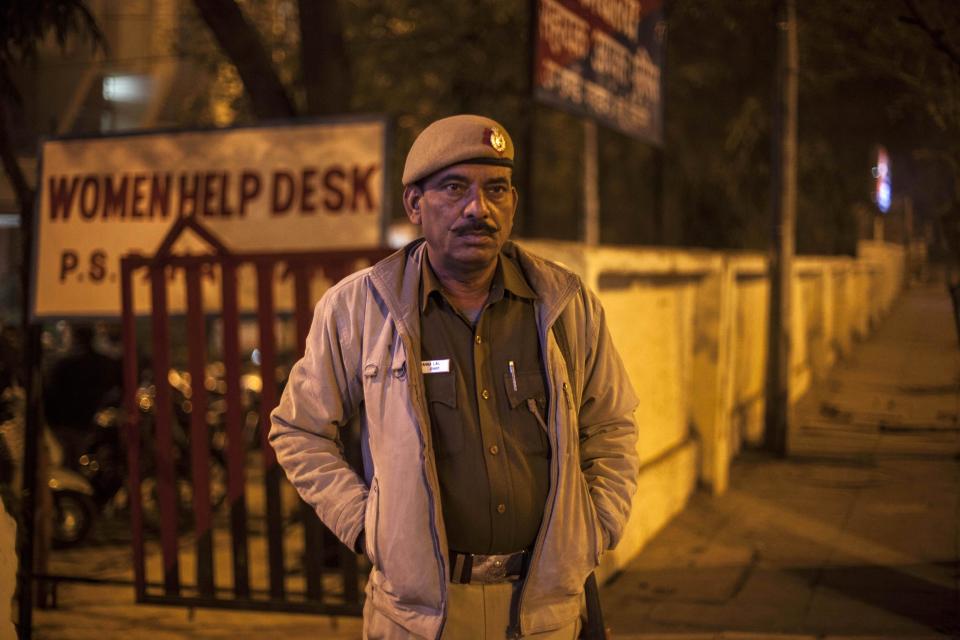 An Indian policeman stands outside the police station which is investigating the gang-rape of a Danish tourist in New Delhi, India, Wednesday, Jan. 15, 2014. A 51-year-old Danish tourist was gang-raped near a popular shopping area in New Delhi after she stopped to ask for directions, police said Wednesday, the latest case to focus attention on the scourge of violence against women in India. The woman managed to reach her hotel in Paharganj area Tuesday evening and the owner called police. (AP Photo/Tsering Topgyal)