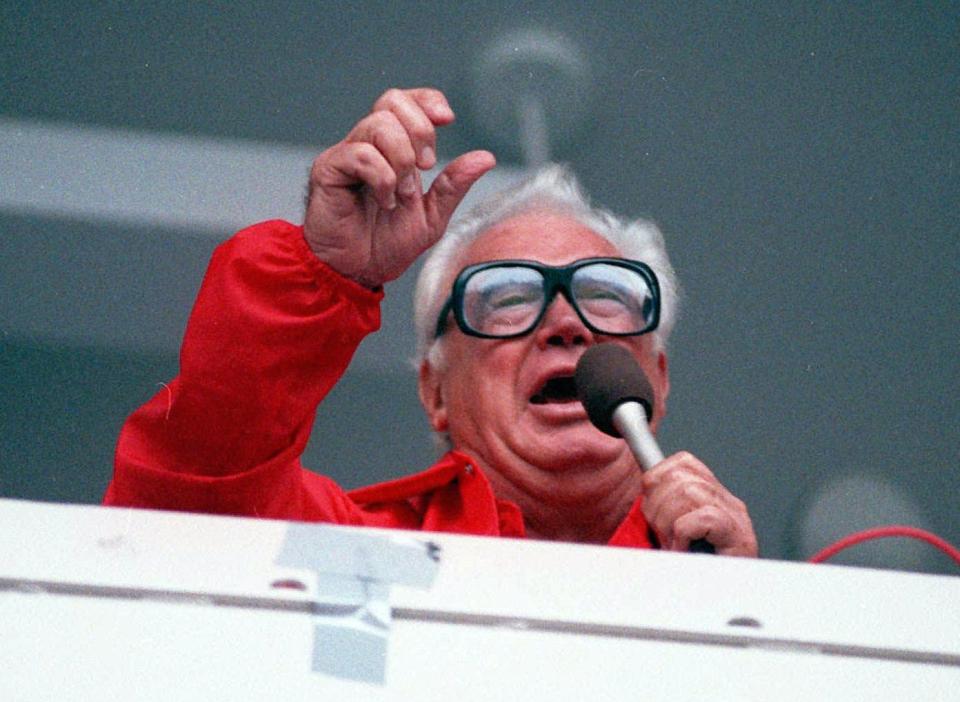 Harry Caray sings "Take Me Out To The Ball Game" in this photo from 1989.