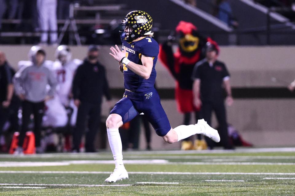 Stephenville quarterback Ryder Lambert (7) sprints down field on a long run during Friday’s Region II-4A Division I final against Melissa at Pennington Field in Bedford on Dec. 3, 2021.