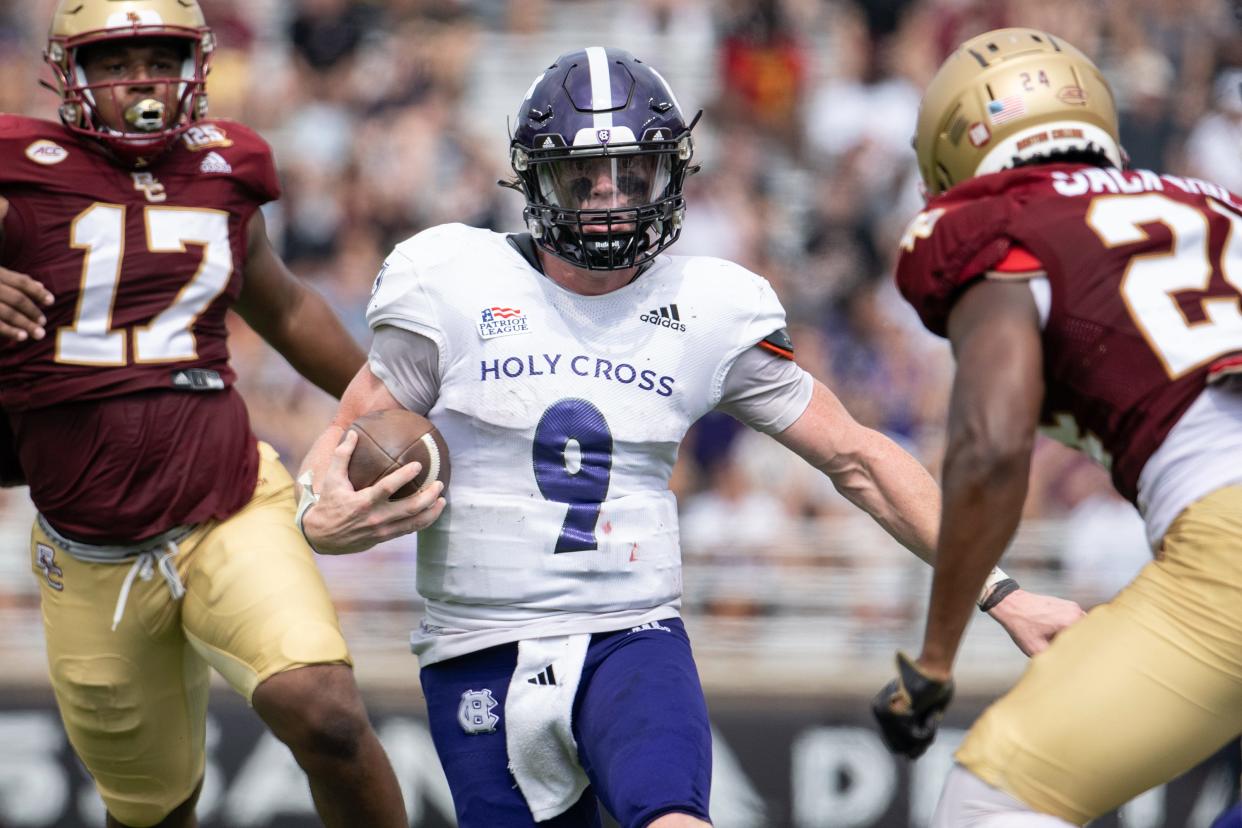 Holy Cross quarterback Matthew Sluka, shown here earlier this season, rushed for 94 yards in the first half Saturday at Bucknell, 122 for the game.