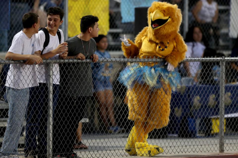 The Golden Eagle mascot of Desert Hot Springs High socializes during the football game against Jurupa Valley in Desert Hot Springs, Calif., on August 25, 2023.