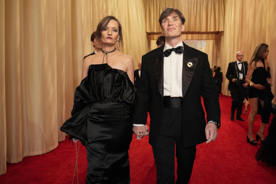 Yvonne McGuinness, left, and Cillian Murphy arrive at the Oscars on Sunday, March 10, 2024, at the Dolby Theatre in Los Angeles. (AP Photo/John Locher)