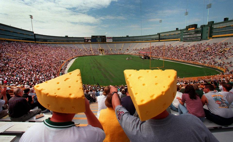 Wisconsinites are now also known as "Cheeseheads." Here are some stockholders wearing cheesehead hats at the Lambeau Field shareholders meeting in 1998.